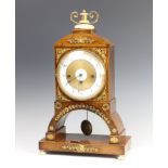 An 18th Century French 8 day striking mantel clock with silk suspension, striking on 2 gongs, having