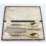 A 19th Century Continental 800 standard serving set comprising knife and 2 gilt decorated spoons,