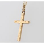 A 9ct yellow gold engraved cross and chain 2.3 grams