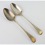 A George III Old English table spoon London 1801 and a George IV ditto 1821, 120 grams