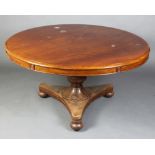A William IV mahogany circular snap top breakfast table raised on turned column and triform base