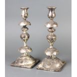 A pair of Continental repousse silver plated baluster candlesticks 30cm