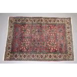 A pink, blue and white ground Kaysari rug with floral pattern within a 3 row border 171cm x 122cm