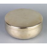 A Korean circular gilt metal jar and cover 9cm x 21cm