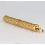 An 18ct yellow gold engine turned toothpick
