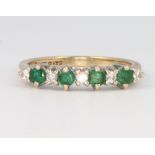 A 9ct yellow gold emerald and diamond half hoop ring size M, 2 grams