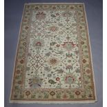 A white ground and floral patterned Caucasian style carpet 261cm x 180cm Some light staining in