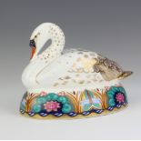 A Royal Crown Derby Imari pattern paperweight of a white pelican with silver stopper 9cm