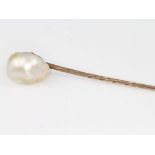 A 9ct yellow gold natural pearl stick pin, 1.4 grams