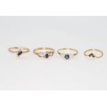Four 9ct yellow gold gem set rings size J, P, Q, and Q