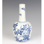 A 19th Century Chinese bottle vase decorated with flowers 18cm There is a crack to the lip