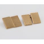 A pair of 9ct yellow gold engine turned rectangular cufflinks 10.9 grams