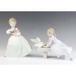 A Lladro figure of a girl sitting on a bench feeding doves 20cm and a Nao figure of a girl