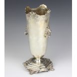 A silver vase with scroll rim and lion ring handles raised on claw feet, 28cm, Birmingham 1926,
