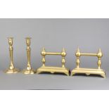 A pair of 19th Century circular brass candlesticks, raised on spreading feet with ejectors 22cm x