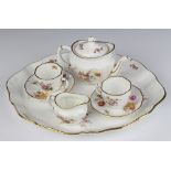 A Royal Crown Derby posies miniature tea set comprising teapot, milk jug, 2 tea cups, 2 saucers