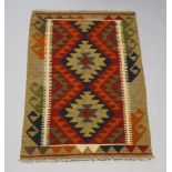 A black, brown and tan ground Maimana Kilim rug 124cm x 180cm