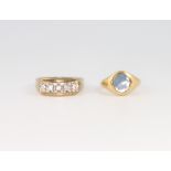 A 9ct yellow gold paste set ring, size T and an 18ct yellow gold hardstone ring size H 1/2