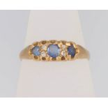 An 18ct yellow gold sapphire and diamond ring, size L, 2 grams