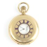 A gentleman's gold plated half hunter pocket watch with seconds at 6 o'clock, the face inscribed