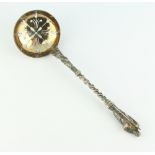 A Victorian silver sifter spoon with apostle handle Sheffield 1884