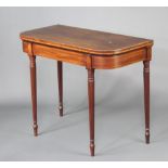 A Georgian bleached inlaid mahogany D shaped card table, raised on turned and reeded supports 73cm h