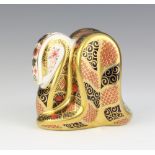 A Royal Crown Derby Imari pattern paperweight of a snake with gold stopper, 8cm