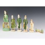 A Chinese slip glazed figure of a dignitary with attendants 26cm, 3 figures of gentleman raised on