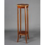 An Edwardian circular inlaid mahogany 2 tier jardiniere stand raised on outswept supports 98cm h x