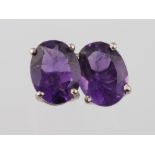 A pair of silver amethyst ear studs