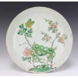 An 18th Century Chinese famille rose shallow dish decorated with a flowering tree 35cm The rim is