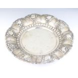 A Continental repousse silver bowl decorated with flowers and fruits 36cm, 968 grams