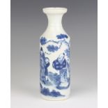 A 19th Century Chinese bottle vase decorated with figures in a garden and script bearing a Kangshi