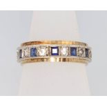 A 9ct yellow gold gem set eternity ring, size N 1/2, 4.6 grams