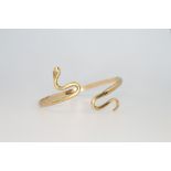 A 9ct yellow gold diamond set snake bangle 19.6 grams