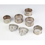 A pair of silver napkin rings Birmingham 1926, 2 others and 2 plated ditto, 82 grams