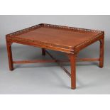 A rectangular Chippendale style occasional table with pierced gallery, raised on square tapered