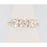 An 18ct yellow gold 3 stone diamond ring, approx. 2.14ct, size M