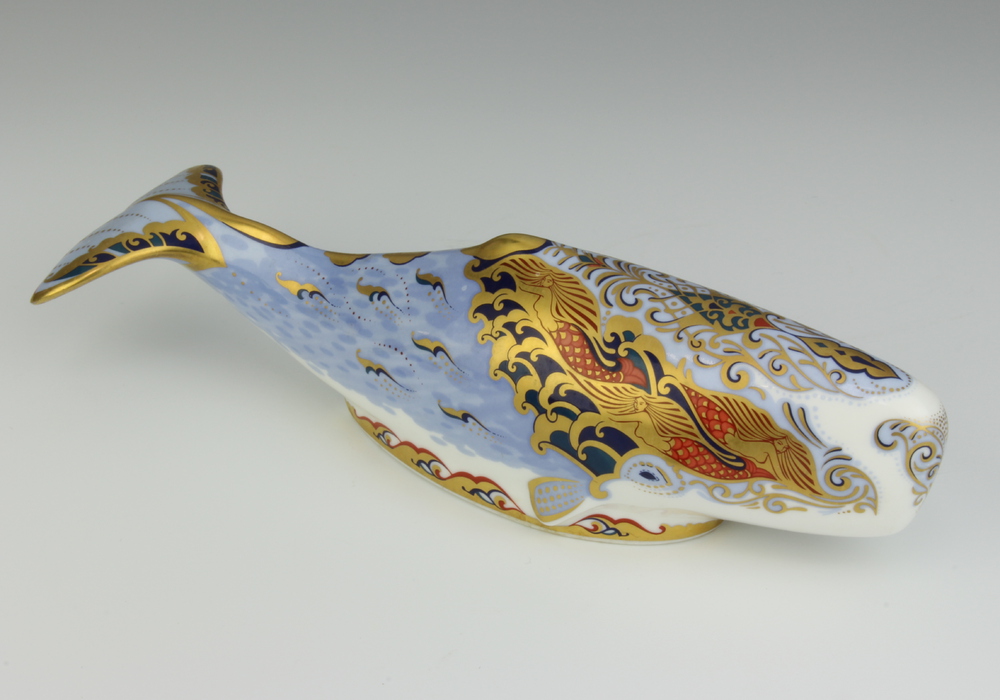 A Royal Crown Derby Imari pattern paperweight - Oceanic Whale with silver stopper 6cm