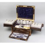 A fine Victorian brass inlaid coromandel toilet box containing 6 silver topped cut glass boxes, 7