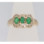 A 9ct yellow gold emerald and diamond triple cluster ring size O 1/2, 3.5 grams