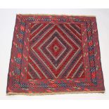 A red and blue ground Gazak rug with diamond medallion to the centre within a 4 row border 118cm x