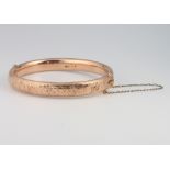 A 9ct yellow gold engraved bangle 11.5 grams