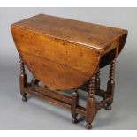 A 17th/18th Century oak drop flap gateleg tea table, fitted a frieze drawer raised on bobbin