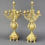 A pair of gilt metal 5 light candelabrum raised on cup and cover support with shaped base 47cm h x