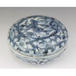 A 19th Century Chinese circular box and cover decorated with a dragon beneath clouds 20cm The lid is