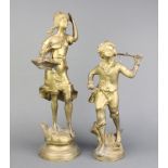 An Art Nouveau style gilt bronze figure of a standing girl with basket of fruit, raised on a