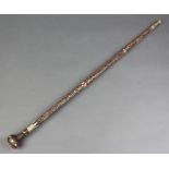 An Indian wire and bone inlaid walking cane (some inlay missing)