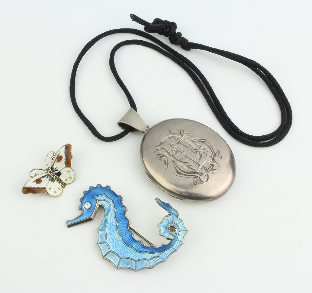 A silver and guilloche enamelled seahorse brooch by David Andersen together with a butterfly