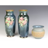 A pair of Royal Doulton oviform vases decorated with flowers 26cm and a Doulton Silicon ware